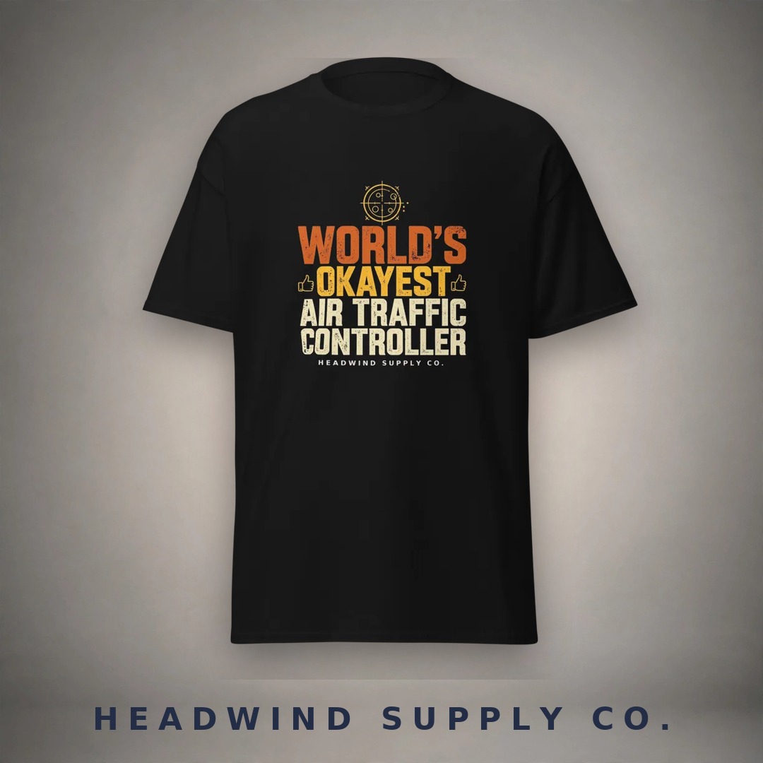 World's Okayest ATC tee on a black shirt